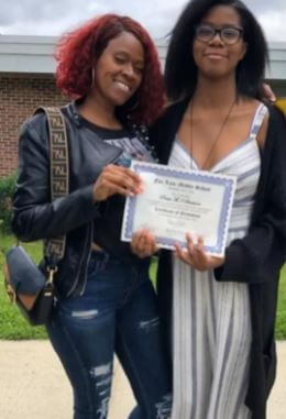 Praise Mary Ella Simmons with her mother during graduation.
